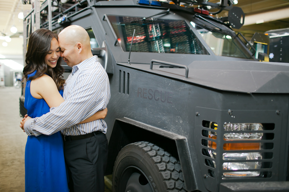 police officer, swat member, swat vehicle, armored vehicle, wedding couple, engaged couple in front of swat vehicle, san francisco swat