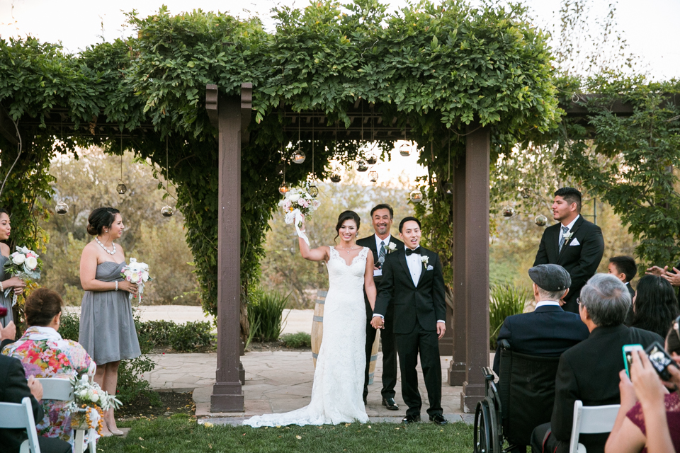 martinelli event center wedding, rustic wedding, rustic winery wedding, outdoor wedding, cartier wedding band, rose gold, first look, vineyards, golden light, livermore wedding, bhldn necklace, low cut lace wedding gown, romantic bride, bay area wedding photographer, jasmine lee photography