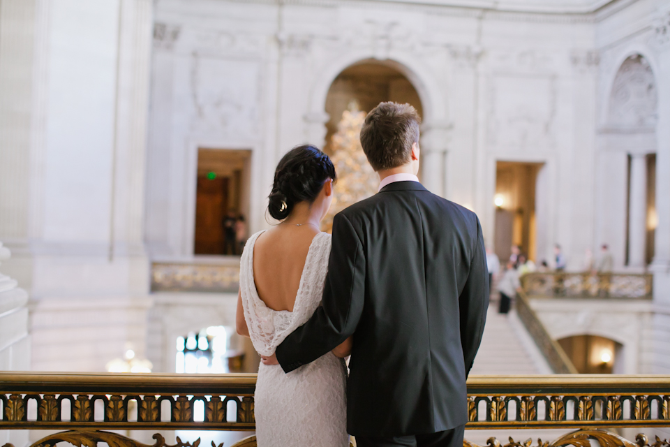 san francisco city hall civil ceremony photographer, ring exchange, city hall, civic center, san francisco engagement photographer, bride and groom back, bride lace back