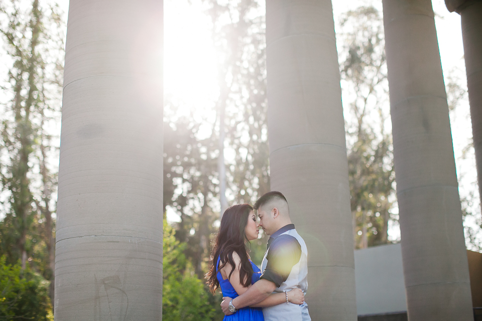 San Francisco Engagement Session, stylish couple, jimmy choo flats, jimmy choo tennis shoes, christian louboutin nude pumps, golden light, spreckels temple of music, golden gate park engagement, marin headlands, golden gate bridge engagement, columns engagement, bicycle prop, sunflowers, blue high-low dress